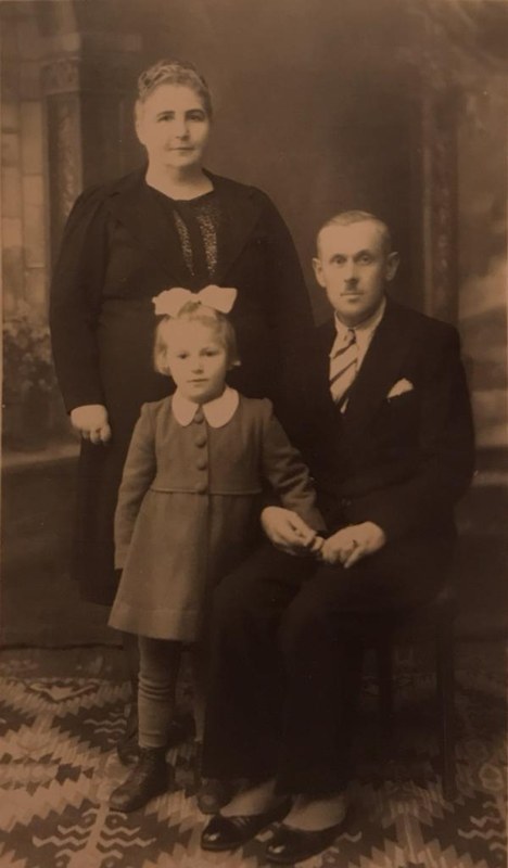 Guta with her adoptive parents in Poland